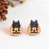 Halloween-themed cat and pumpkin earrings on a white background