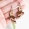 Eagle-shaped wooden hook earrings with mountain and fox design