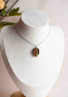 Necklace with a pendant of lily of valley