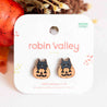 Cat-shaped pumpkin earrings on a 'Robin Valley' branded card with decorative elements.