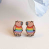 capybara wears a rainbow jumper earrings